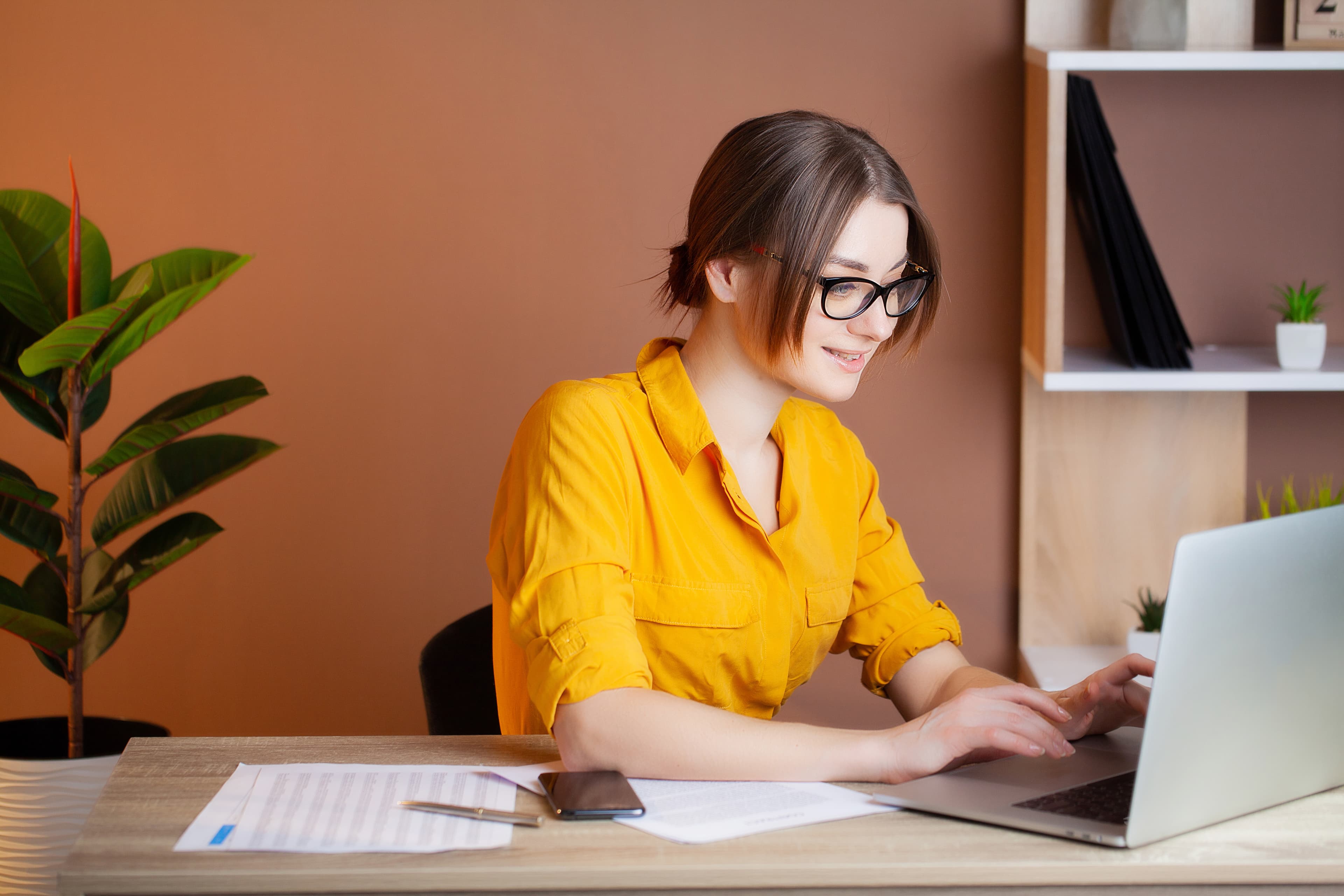 Female in yellow blouse on tablet