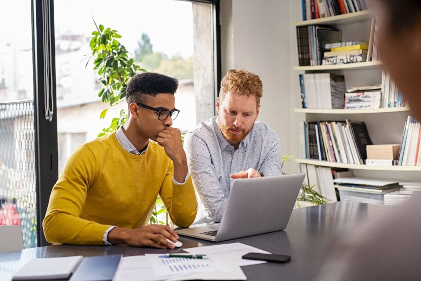 Two men at desk