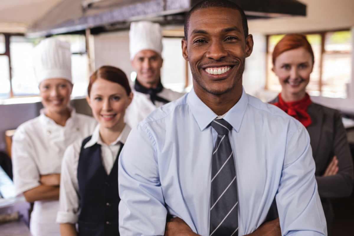 People working in hotel with arms crossed