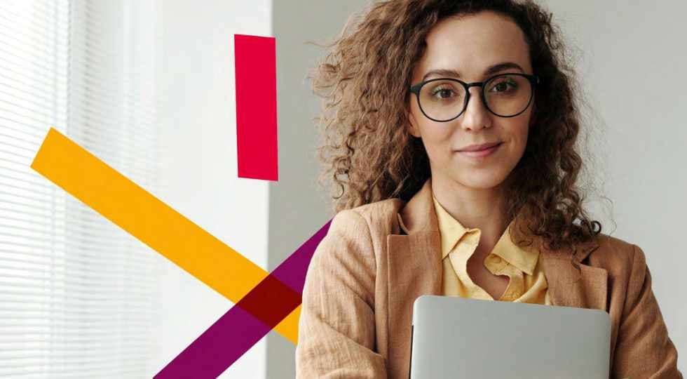 Woman with glasses holding tablet