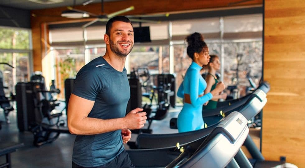 Man on treadmill smiling