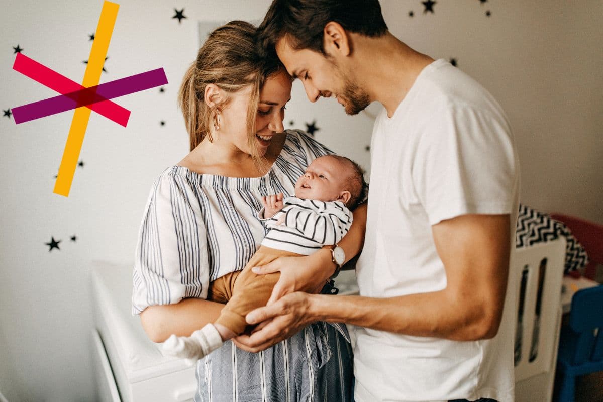 Young couple holding baby