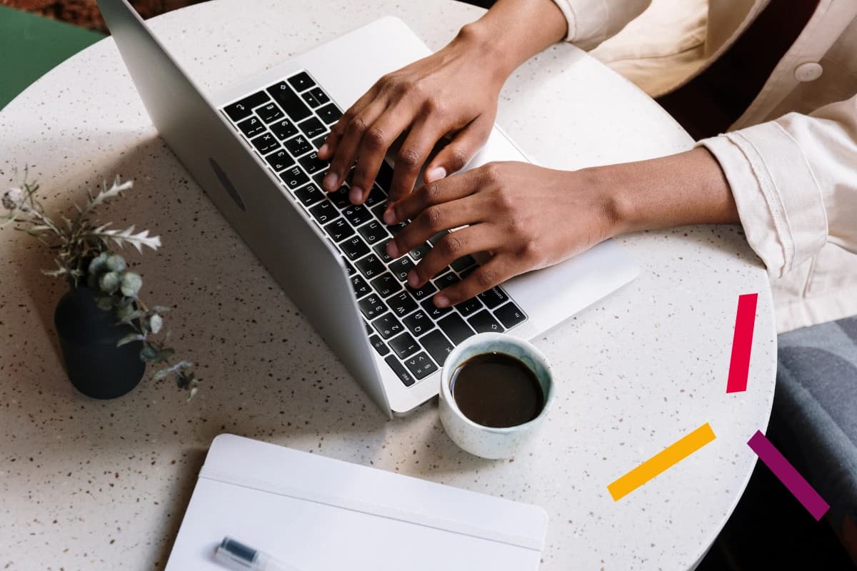 woman at laptop with coffee