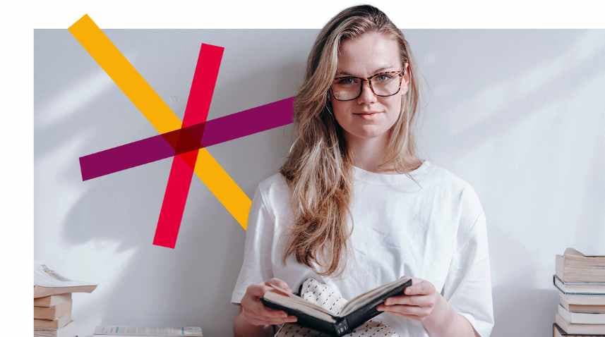 Woman smiling while holding book 