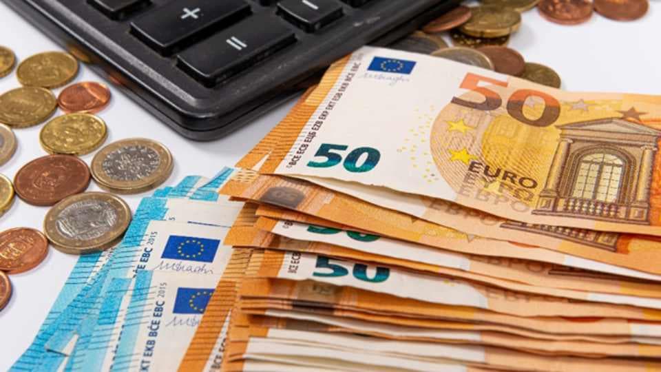 Money notes and coins on table