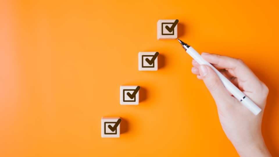 Wooden blocks on orange background 