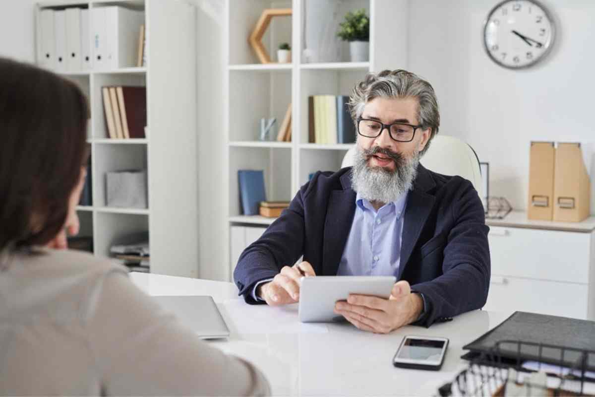 Person at table with tablet