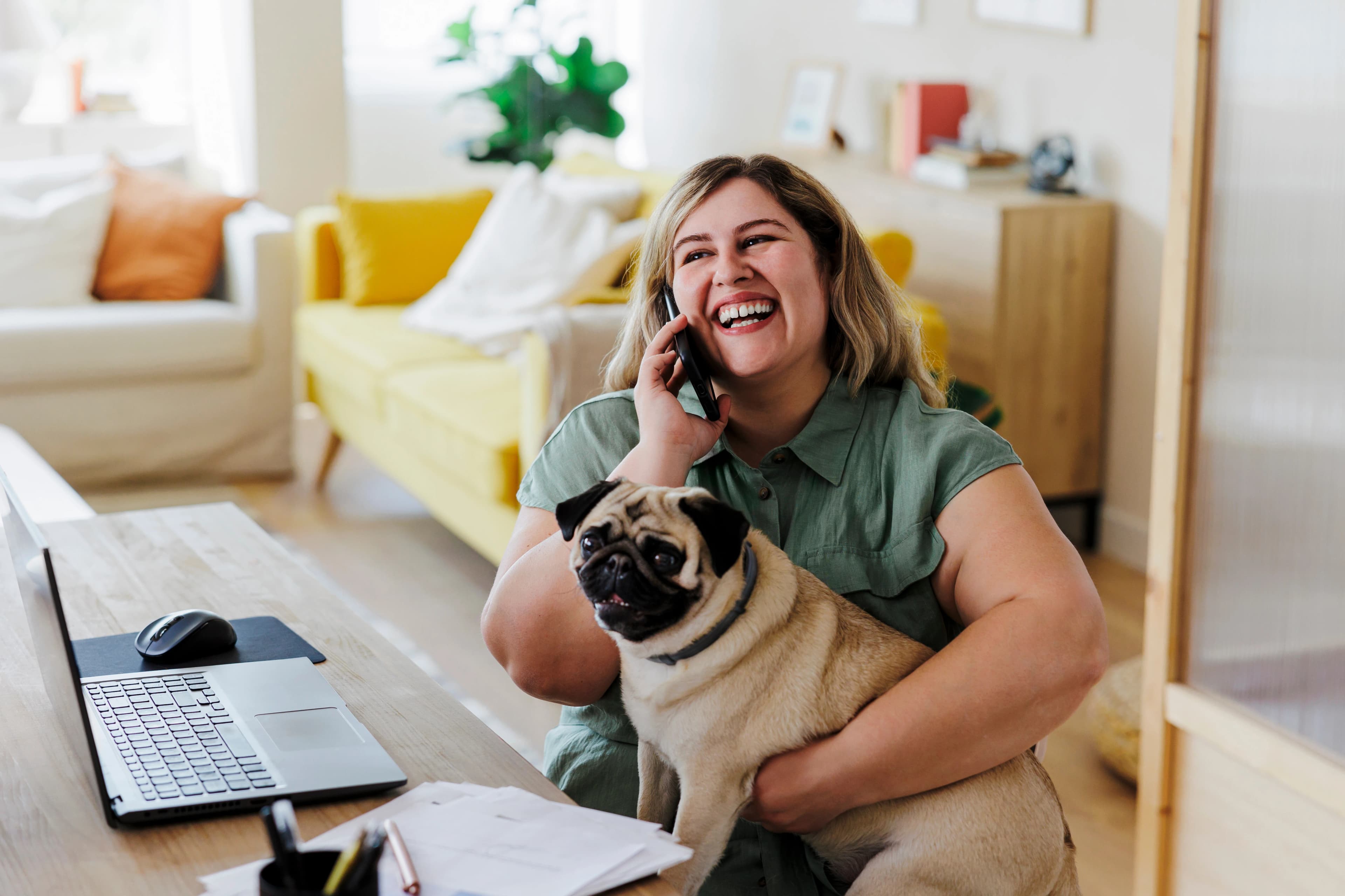 Woman with dog at desk